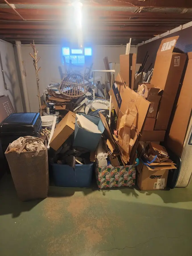 Roll-off dumpster container at job site for 2 Yard Dumpster Rental in Genoa